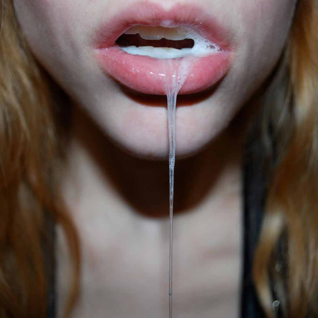 sissy with her open mouth full of semen