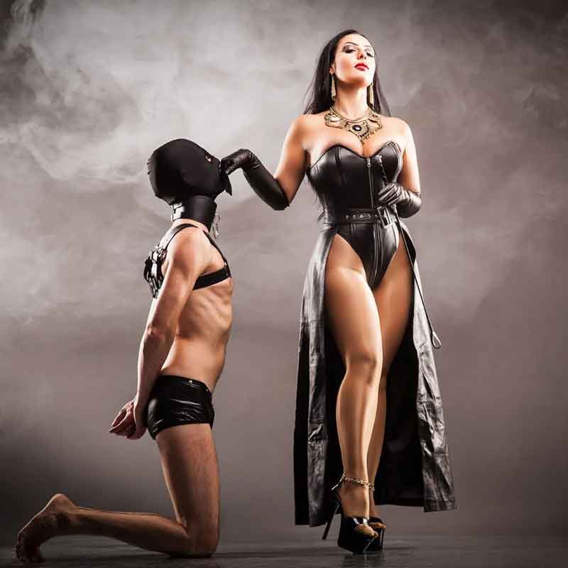 mistress of the worship by a submissive on his knees